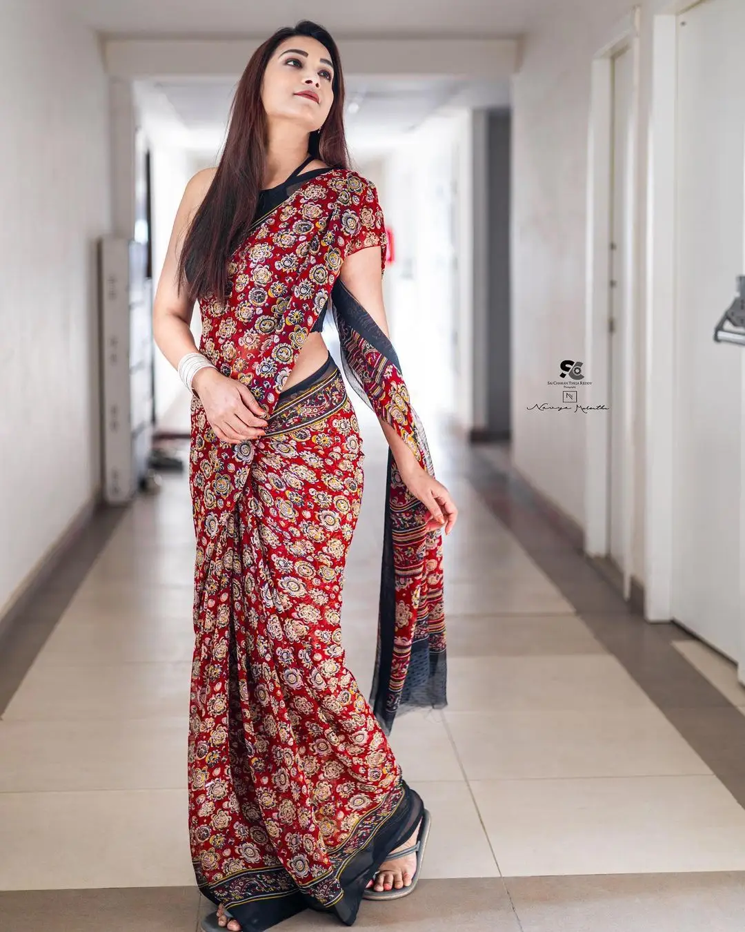 Bhanu Sri Wearing Maroon Saree Sleeveless Black Blouse